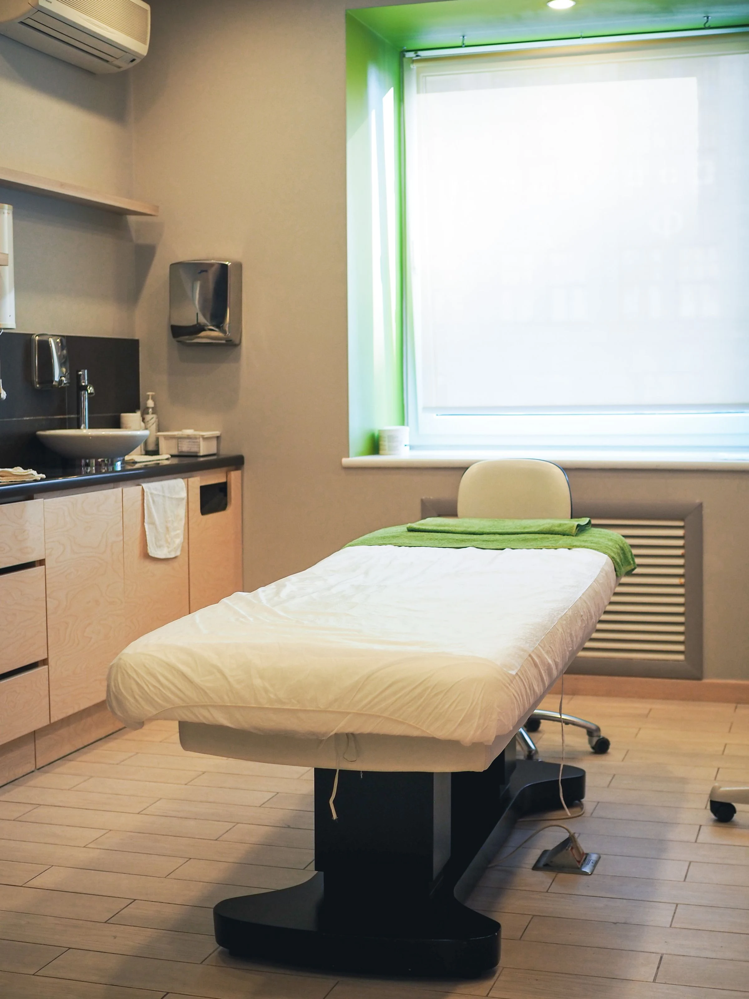Clinical examination room with a medical bed